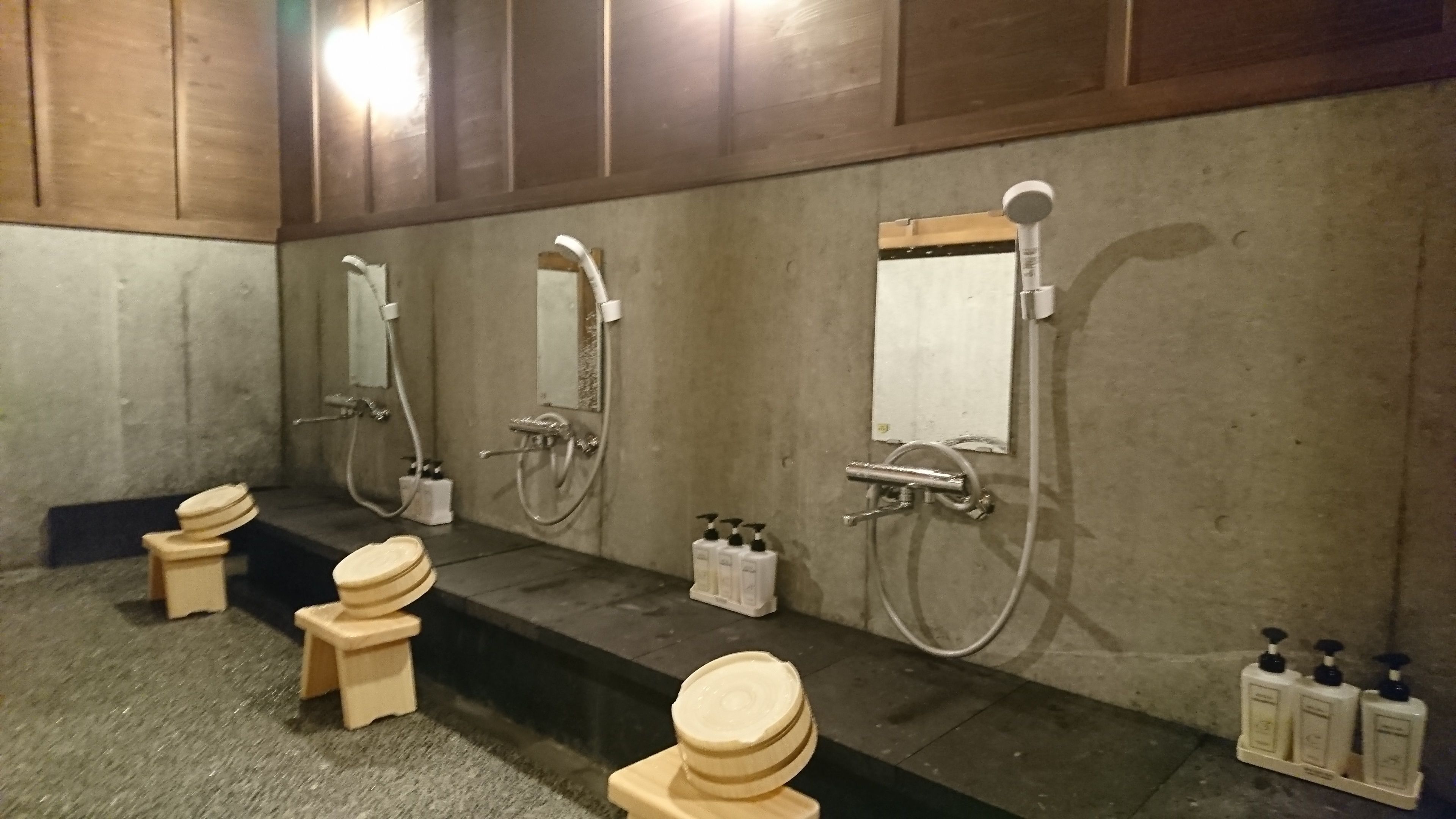 A public restroom with multiple toilets and sinks.