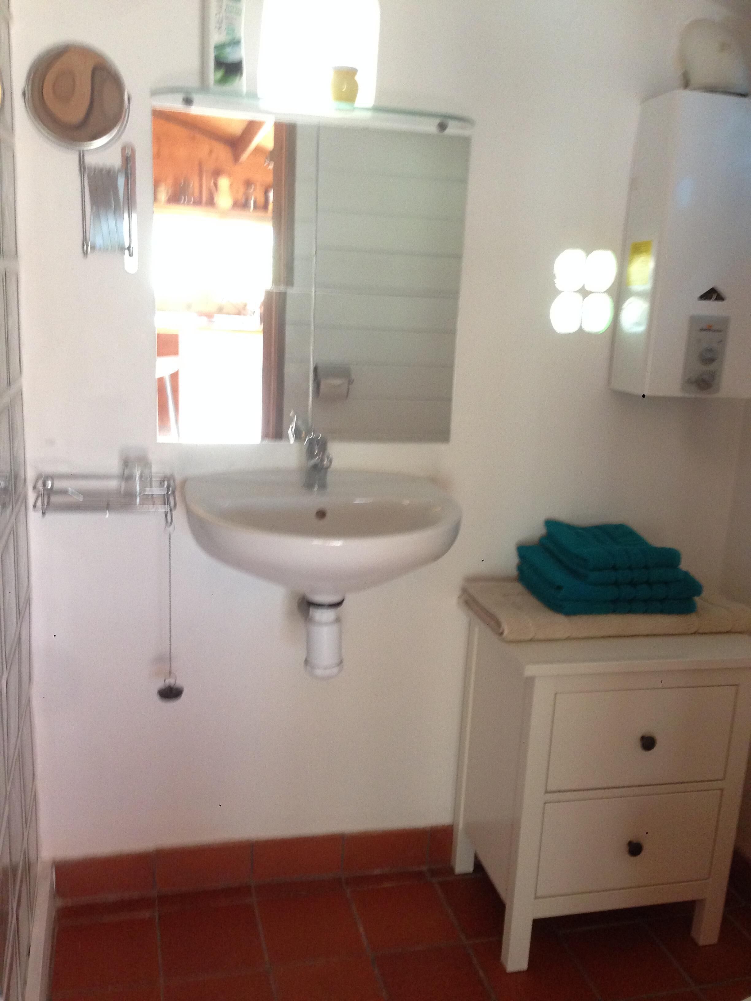 Shower, eco-friendly toiletries, towels, soap