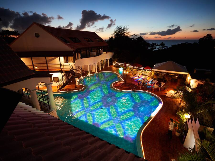 Seasonal outdoor pool, open 8:00 AM to 10:00 PM, pool umbrellas