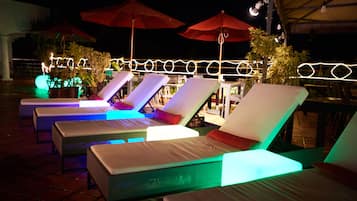 Seasonal outdoor pool, open 8:00 AM to 10:00 PM, pool umbrellas