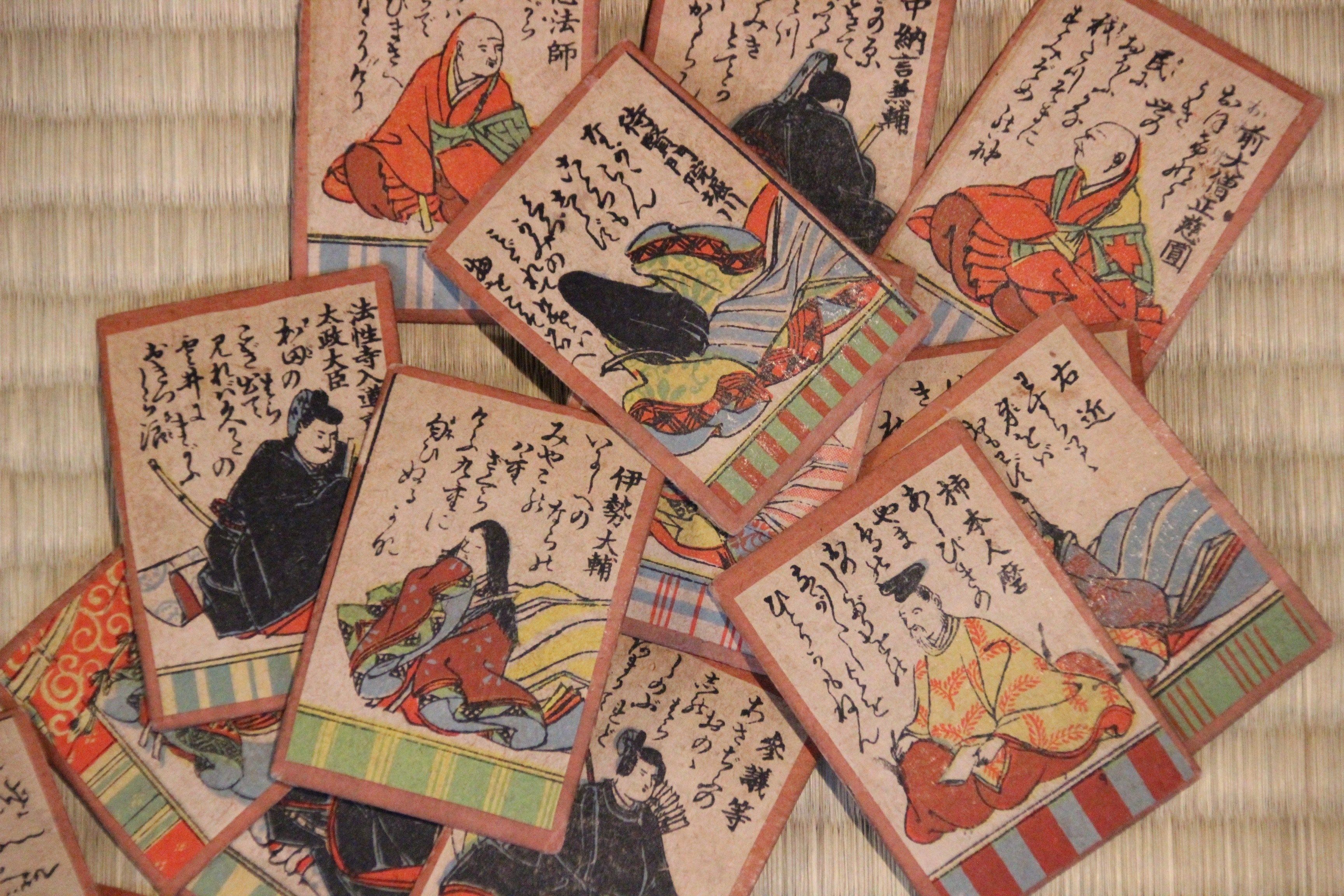 A collection of traditional Japanese playing cards with various characters and text.