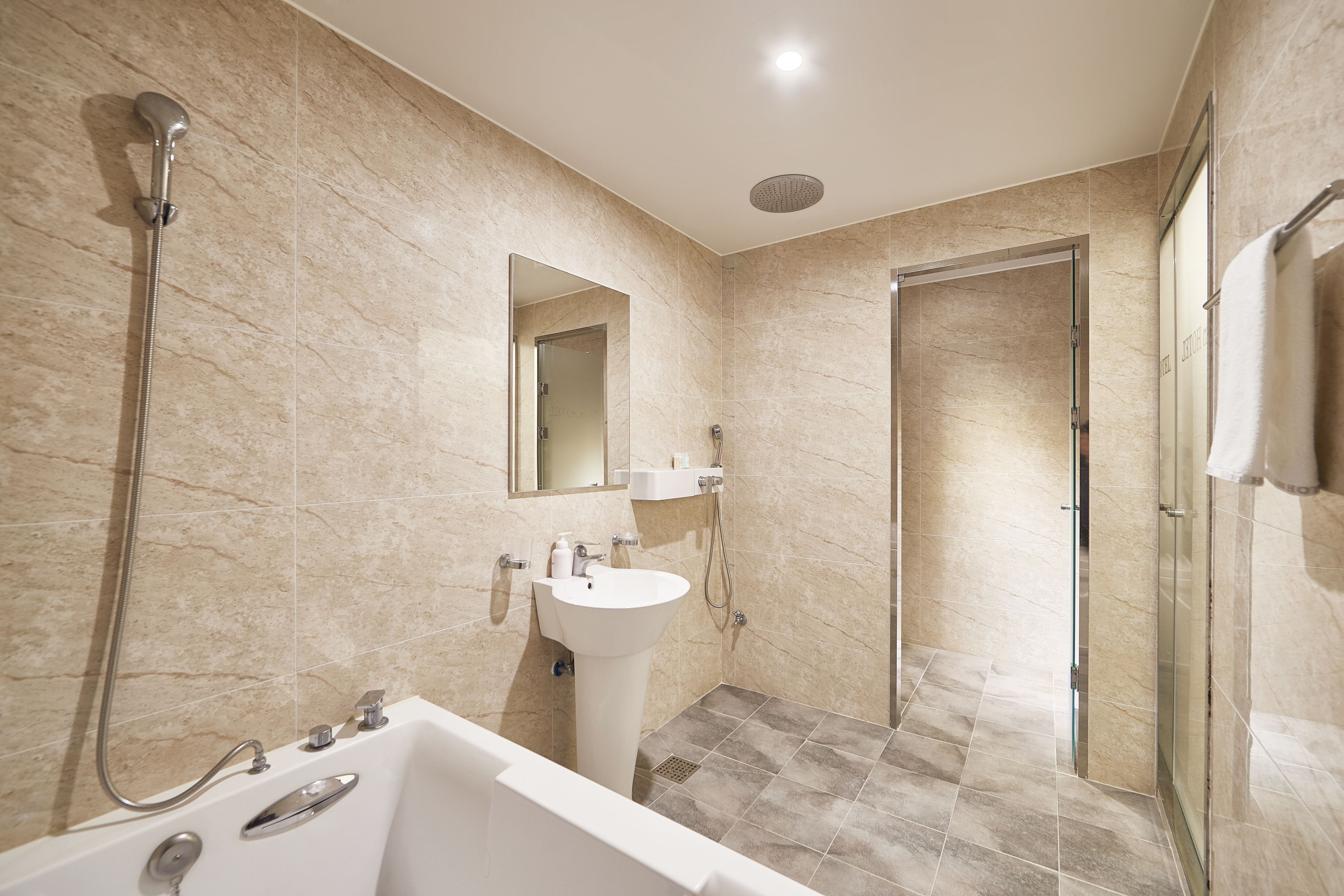 family twin room | bathroom | separate bathtub and shower, deep-soaking bathtub, free toiletries