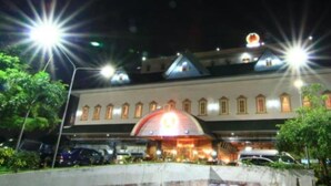 A hotel with a prominent dome structure, multiple windows, and a well-lit entrance. - 13 Coins Ngamwongwan Hotel (Nonthaburi)
