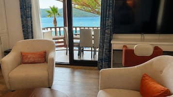 Luxury Condo, Sea View | Living area | LCD TV