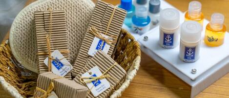 A basket of toiletries and a display of hair care products.