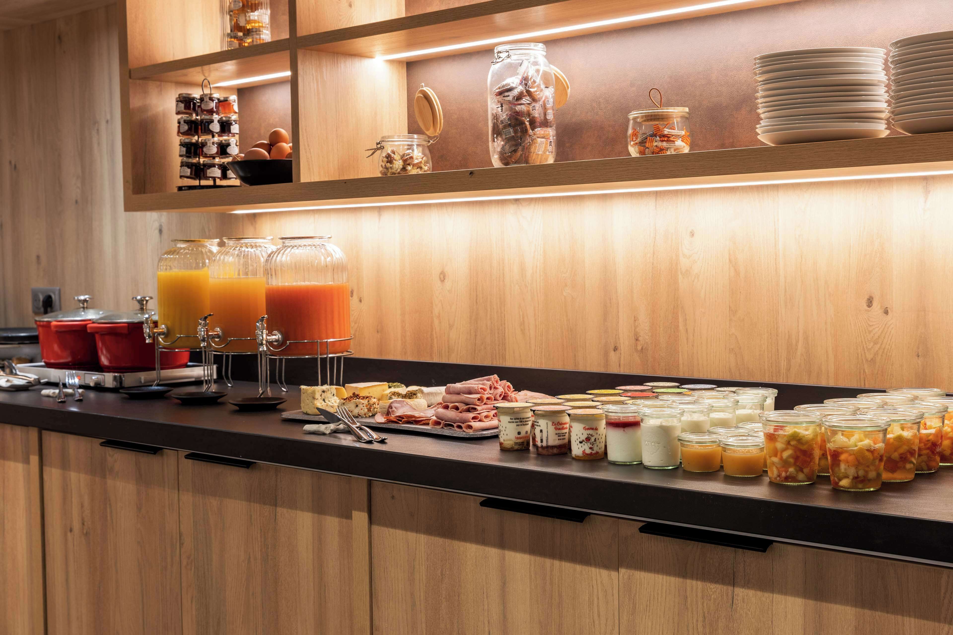 A breakfast buffet with various food items and beverages.