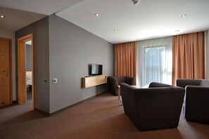 Apartment, 1 Bedroom | Living room | Flat-screen TV