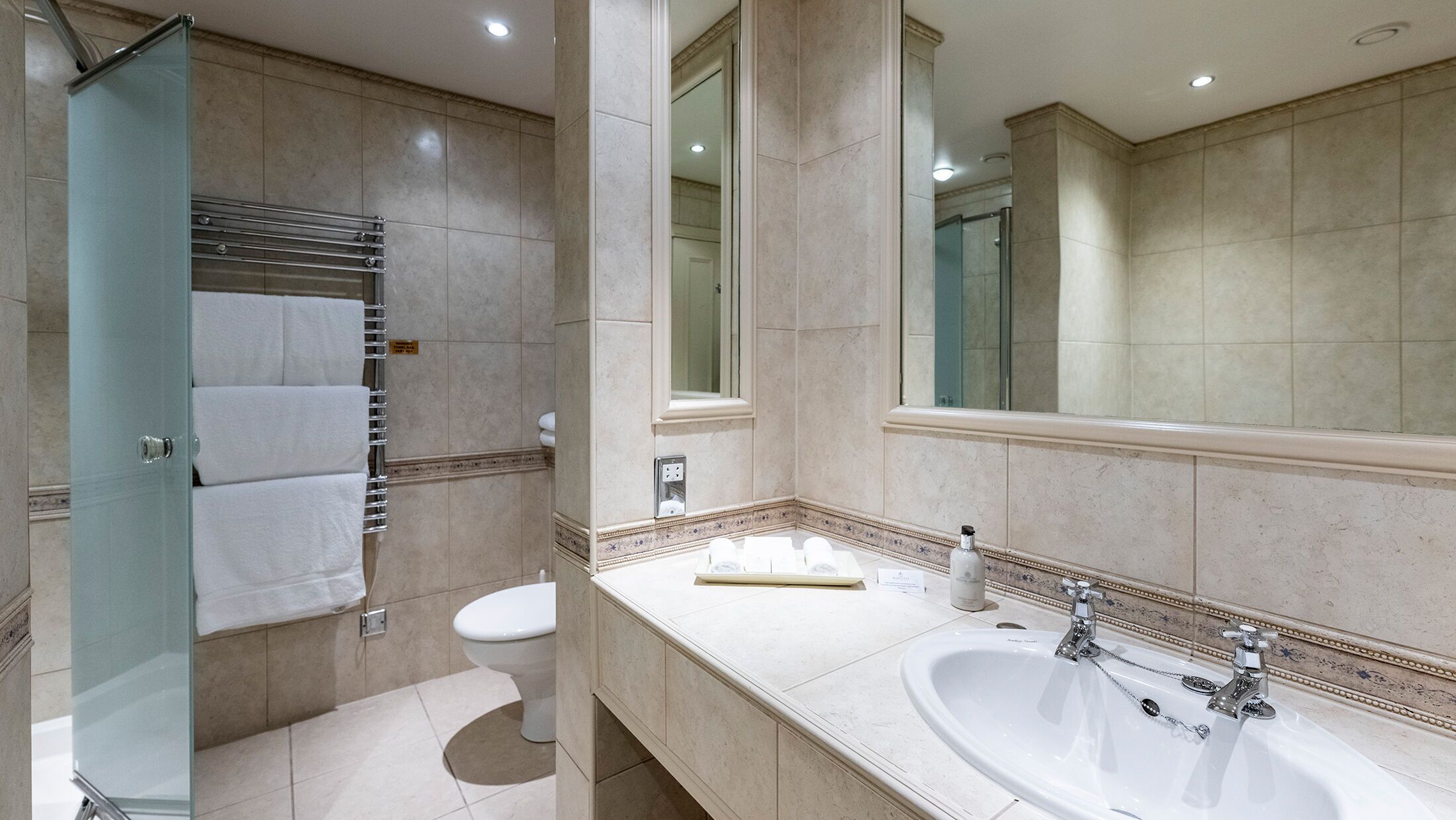 suite | bathroom | designer toiletries, hair dryer, bathrobes, slippers