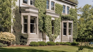 A large, two-story house with a well-maintained lawn and garden. - Marcliffe (Aberdeen)