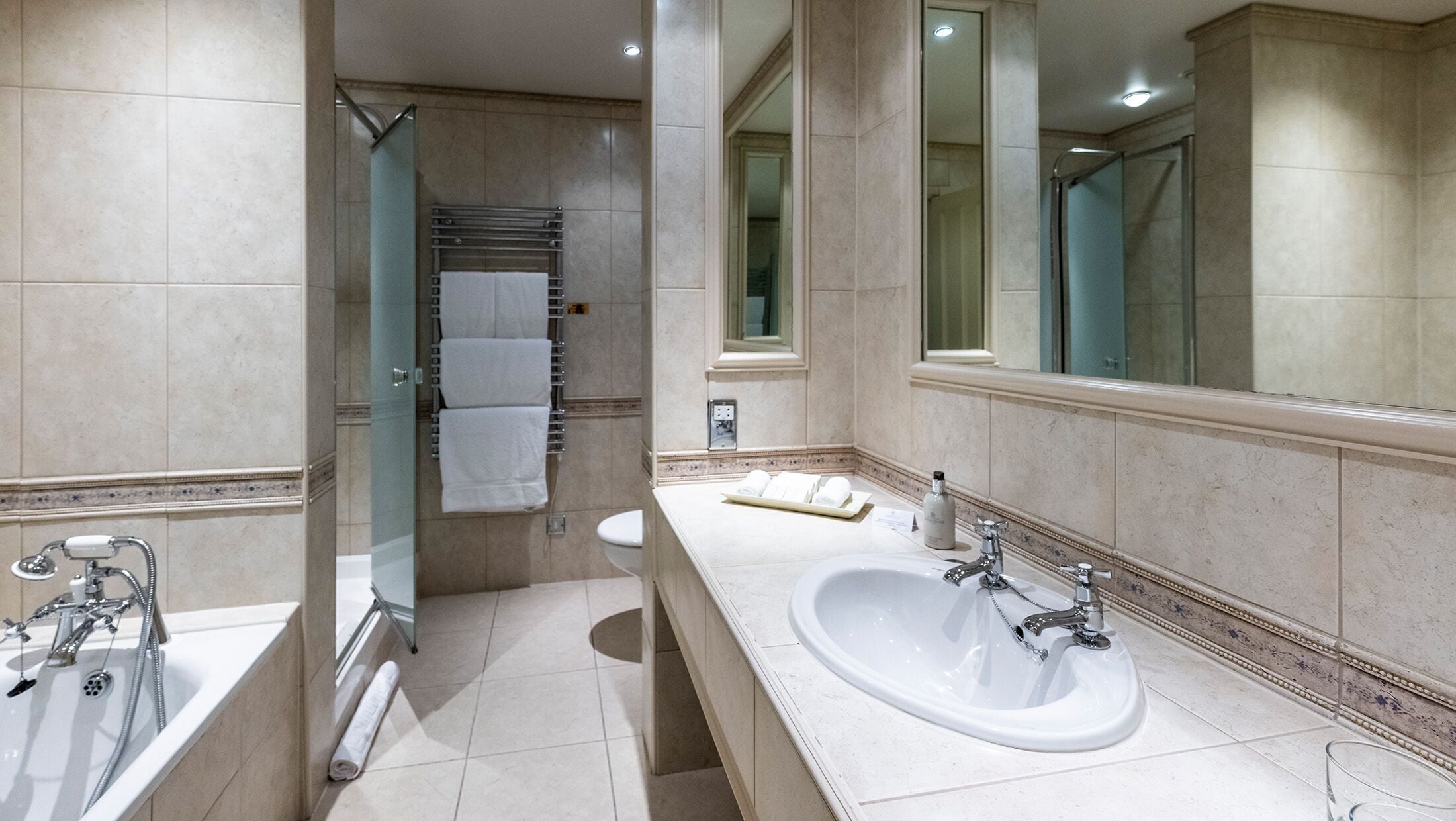 suite | bathroom | designer toiletries, hair dryer, bathrobes, slippers