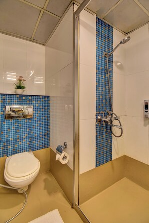 A bathroom with a shower, toilet, and a sink. - Hotel Lotus Ivy Studios,Near Pune Airport (Pune)