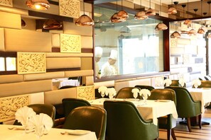Breakfast, lunch, dinner served; Indian cuisine, garden views