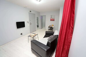 Suite, 1 habitación | Escritorio, insonorización, tabla de planchar con plancha y wifi gratis 