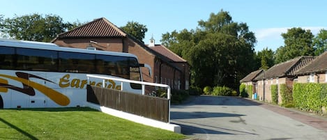 A bus parked in front of a building with a sign reading "Earside."