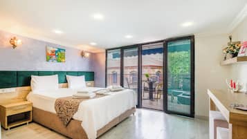 Family Triple Room | Premium bedding, minibar, in-room safe, individually decorated