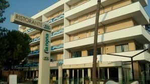 A multi-story hotel with a sign for a restaurant on the ground floor. - Residence La Nona (Cervia)