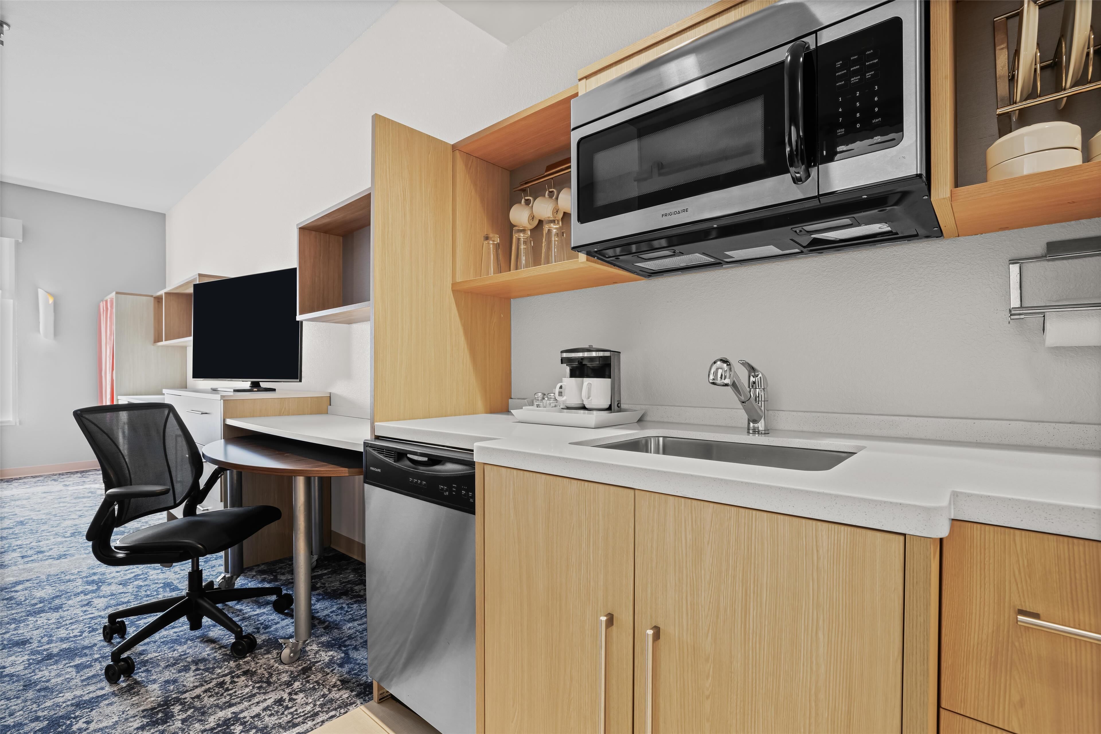 full-sized fridge, microwave, dishwasher, coffee/tea maker