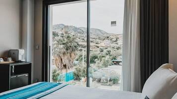 Premium bedding, down comforters, minibar, in-room safe