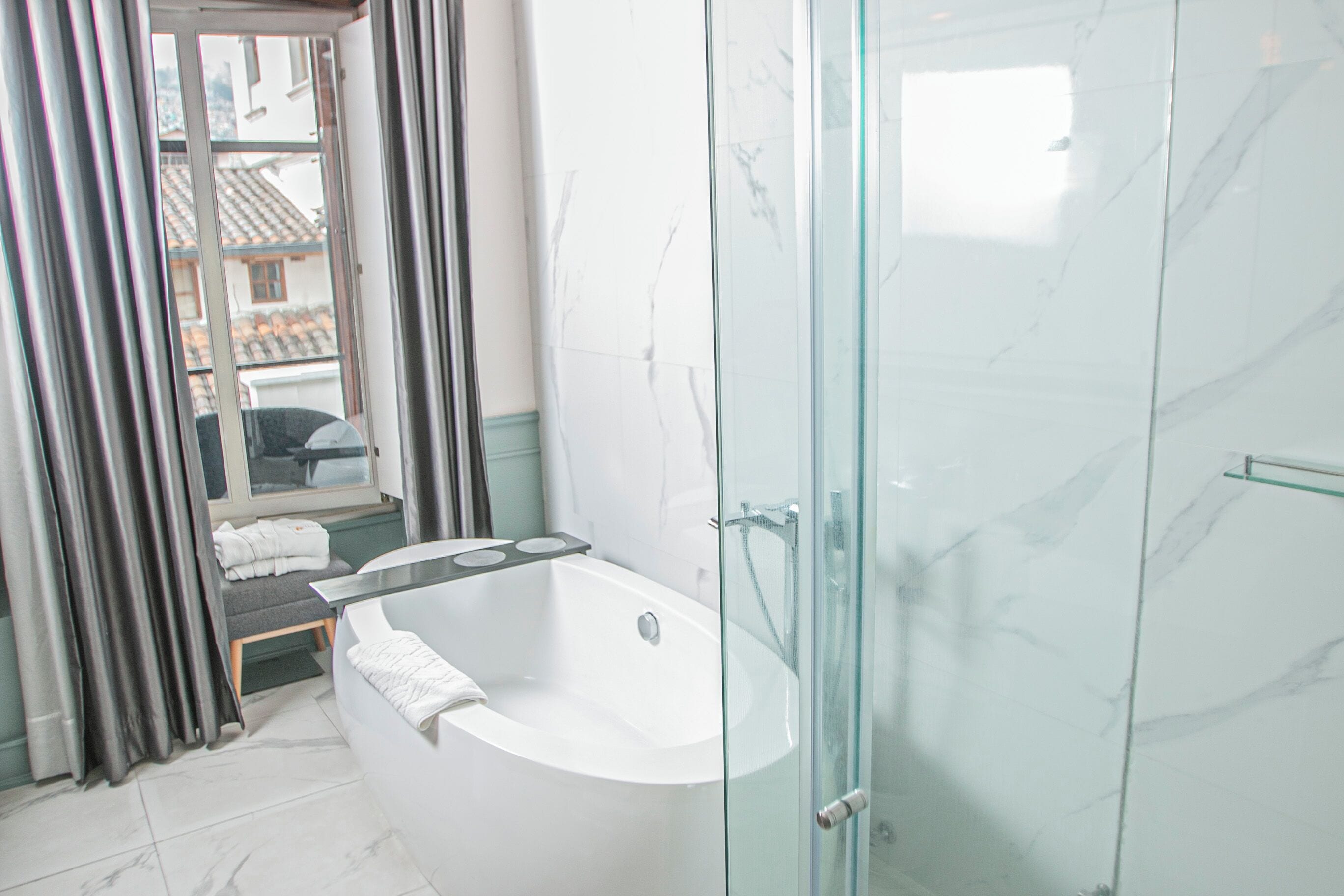 luxury twin room | bathroom | designer toiletries, hair dryer, bathrobes, slippers