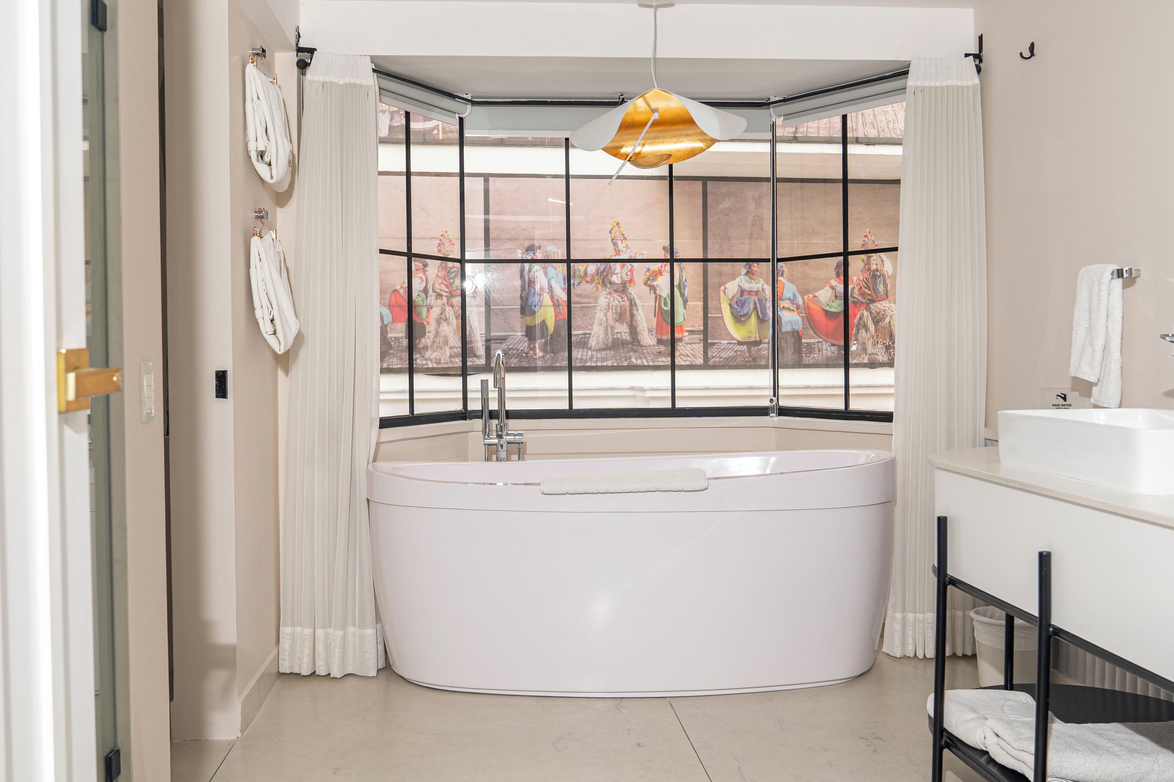 suite | bathroom | designer toiletries, hair dryer, bathrobes, slippers