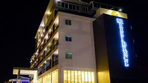A multi-story hotel with illuminated signage reading "SR RESIDENCE." - SR Residence Hotel (Phetchabun)