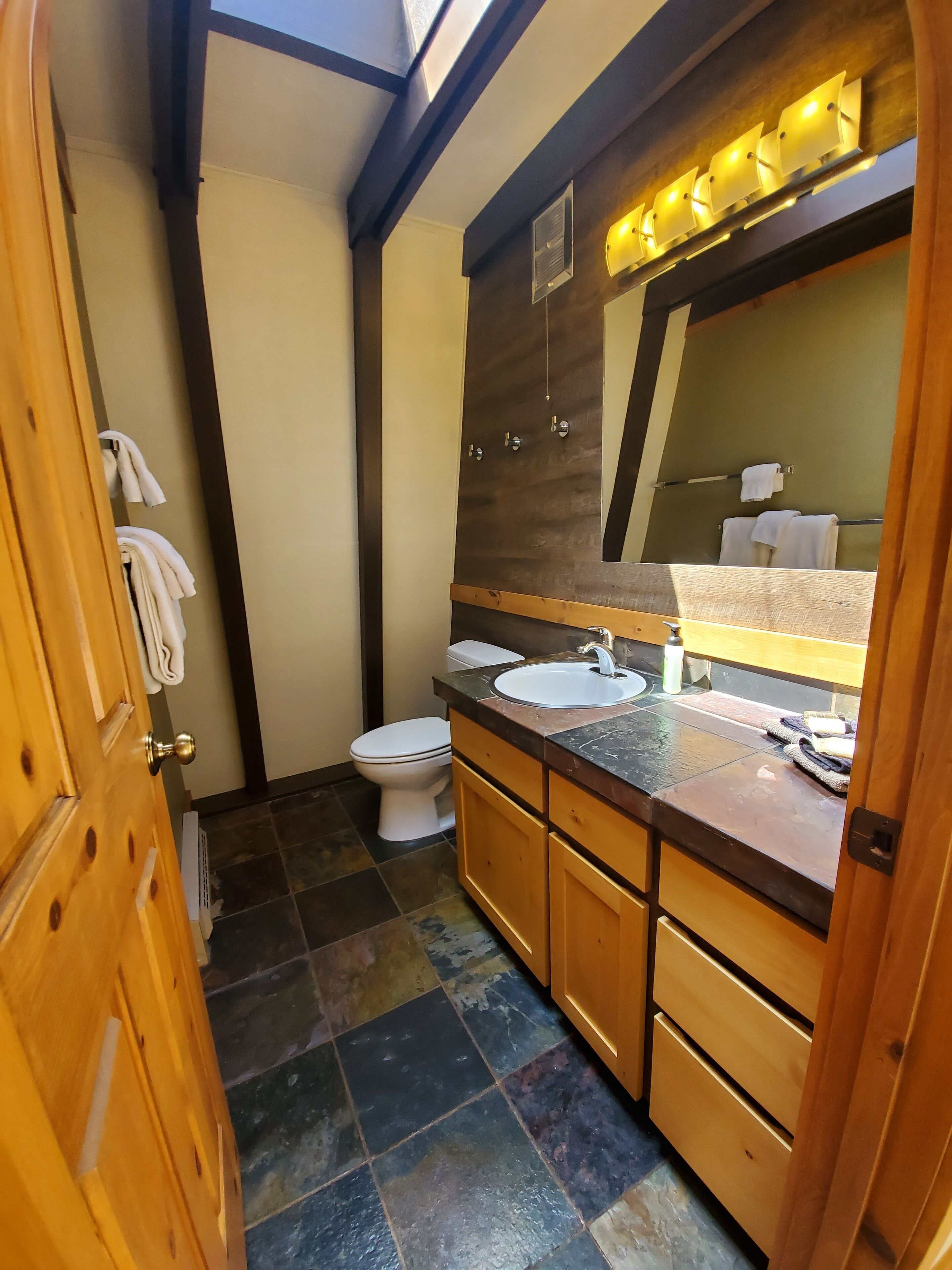 Upstairs bathroom has a small stall shower. No bathtub. 