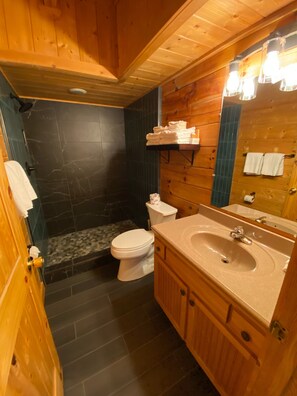 Combined shower/bathtub, towels - Real Log Cabin w/ Secluded Hot Tub, Cozy Loft, WiFi & Close to All Attractions! (Pigeon Forge)