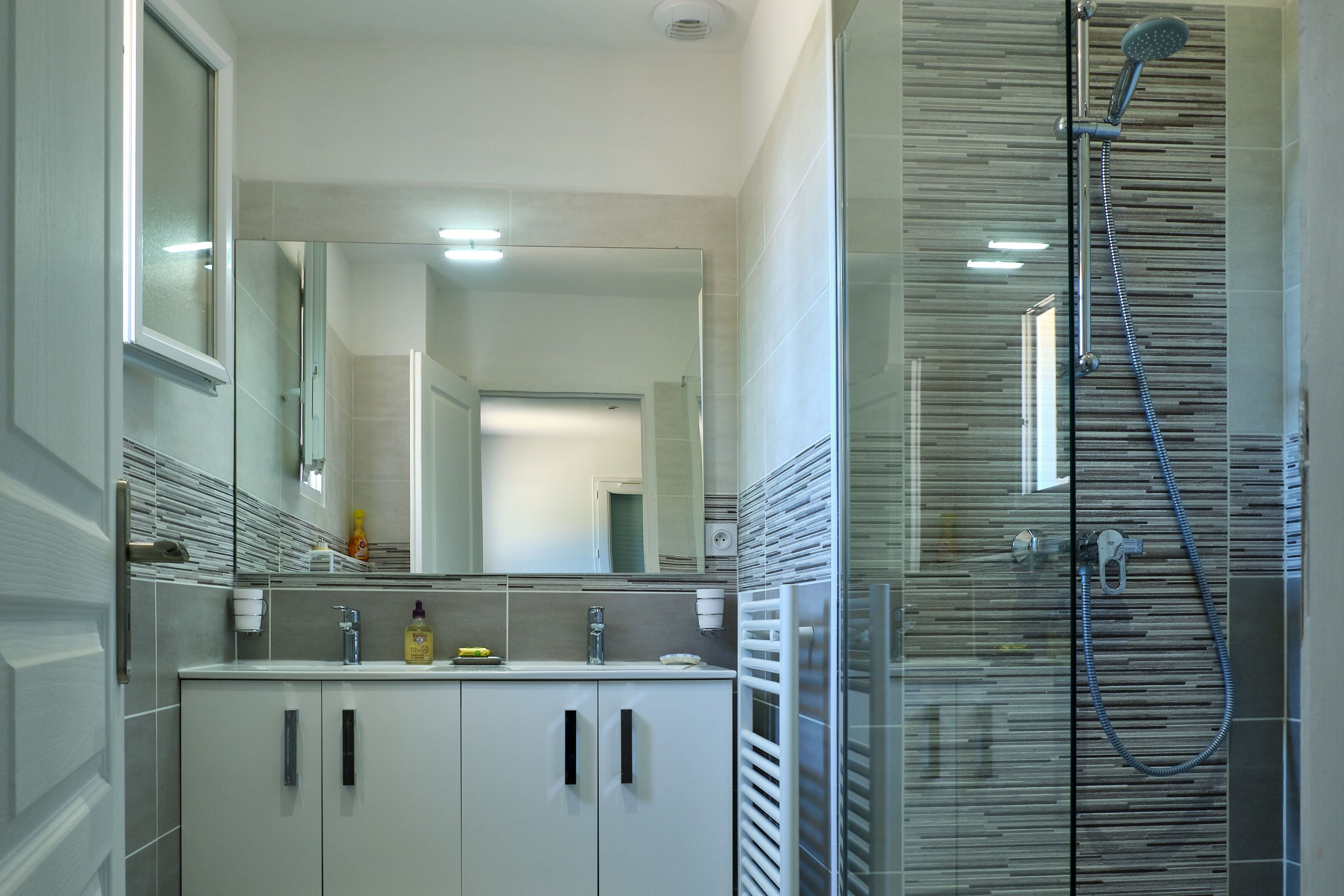 Shower, hair dryer, towels, soap