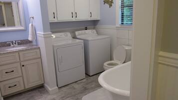 Combined shower/bathtub, hair dryer, towels, soap