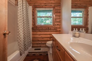 Combined shower/tub, towels, soap, shampoo