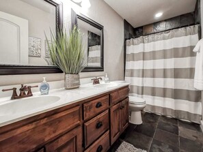 Bathtub, hair dryer, towels, soap