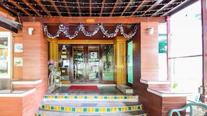 A wooden entrance with a tiled staircase leading up to a door marked "17/99". - Thai Garden Resort (Bangkok)