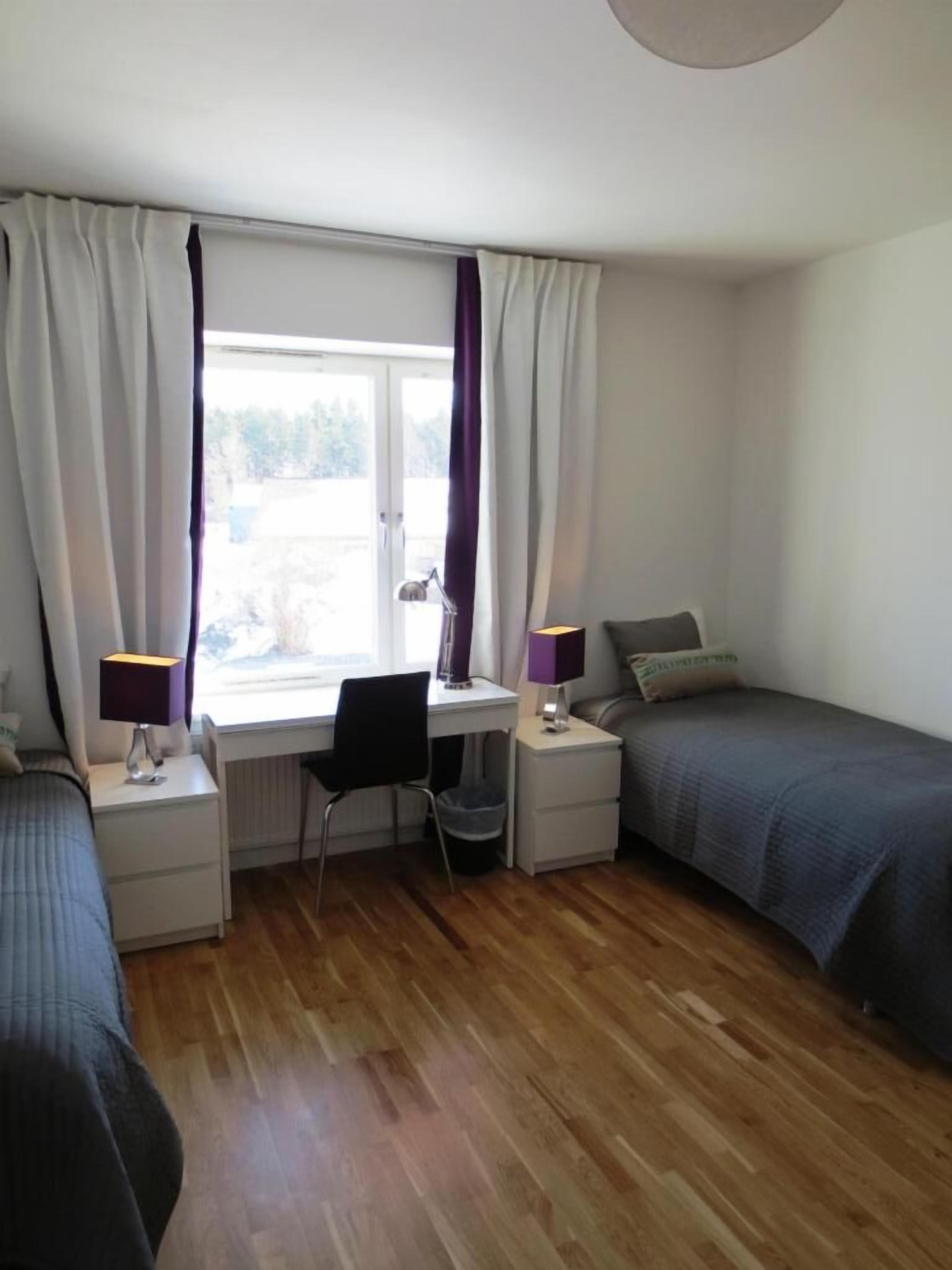 premium bedding, pillow-top beds, desk, laptop workspace