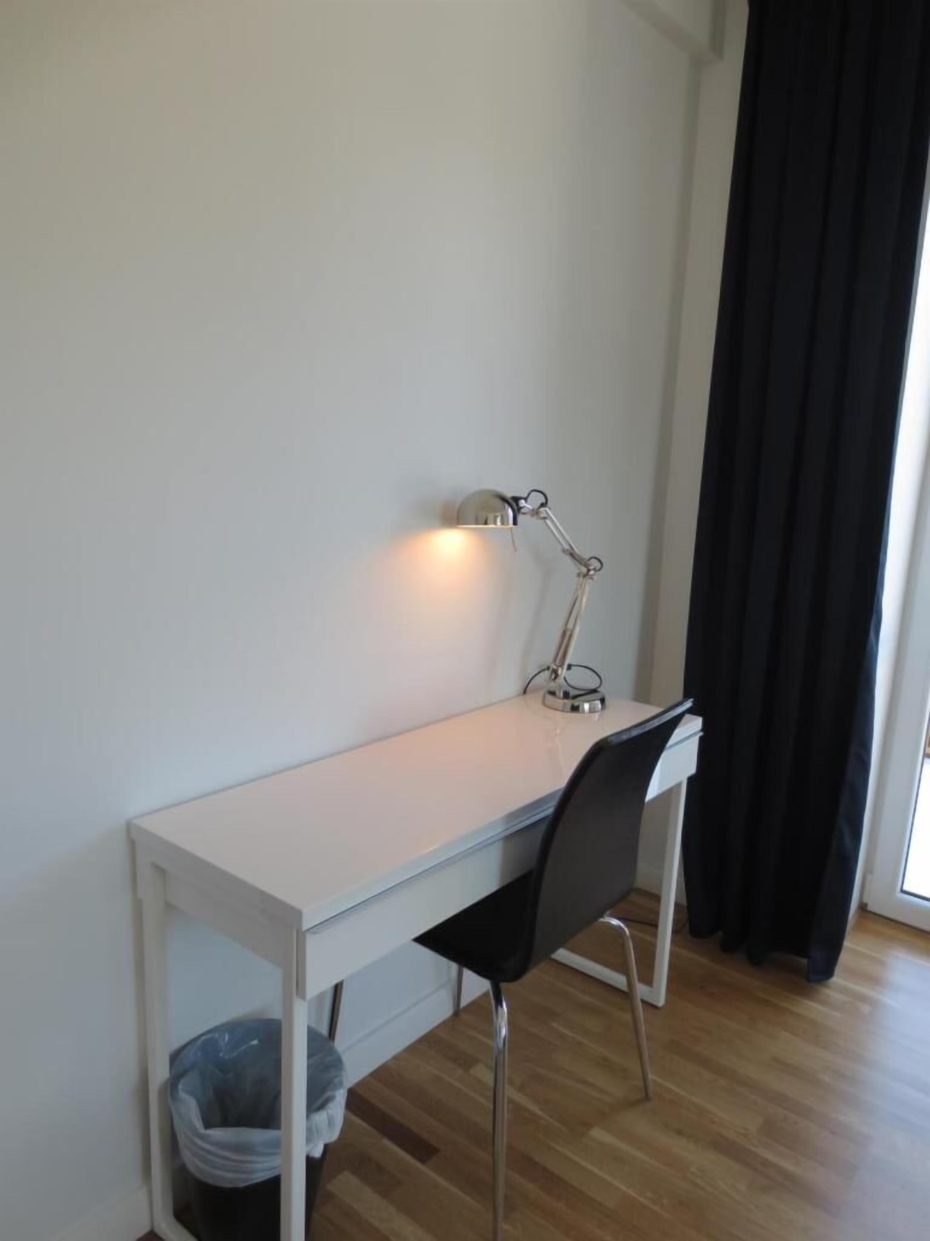 premium bedding, pillow-top beds, desk, laptop workspace