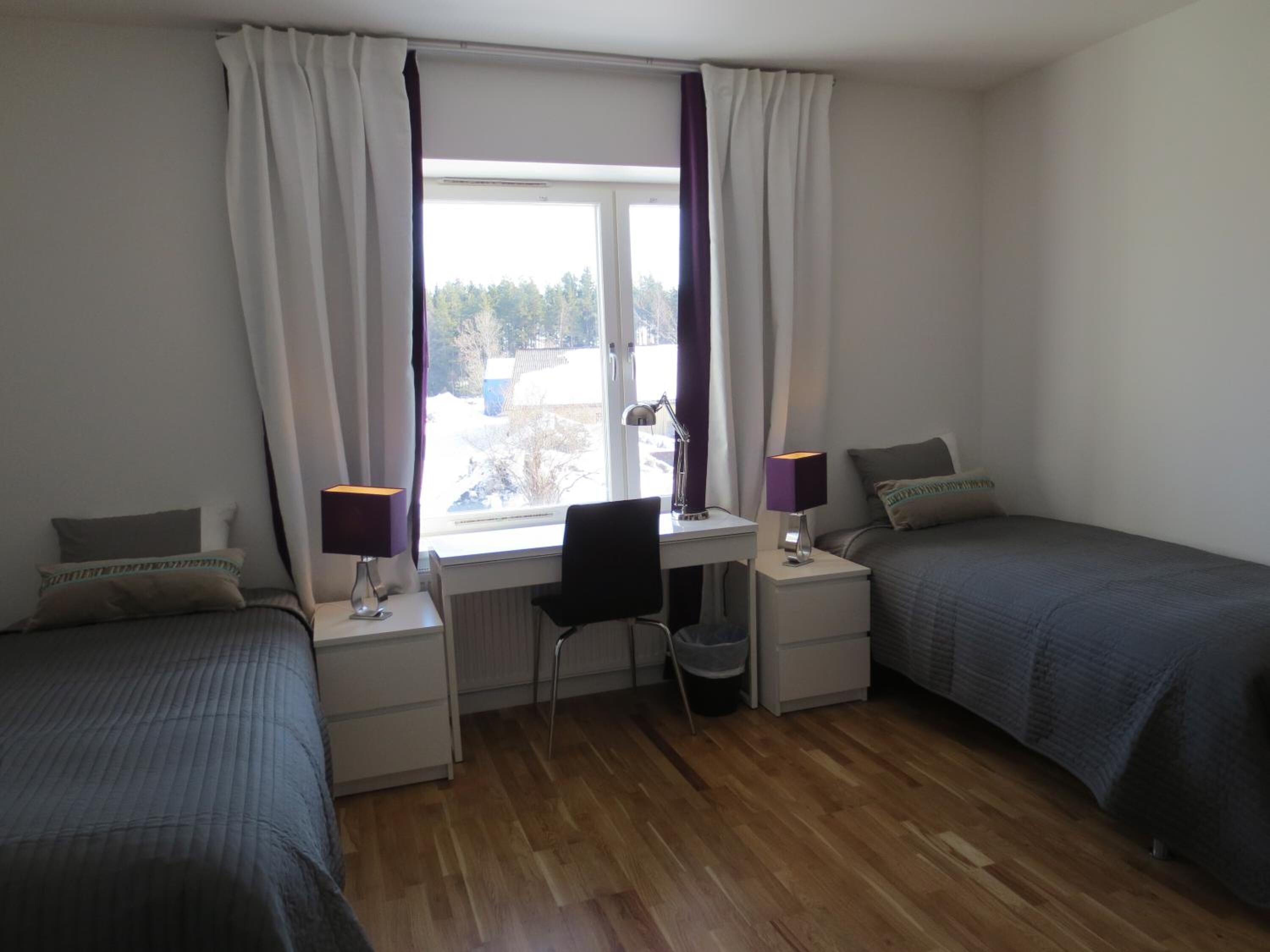 premium bedding, pillow-top beds, desk, laptop workspace