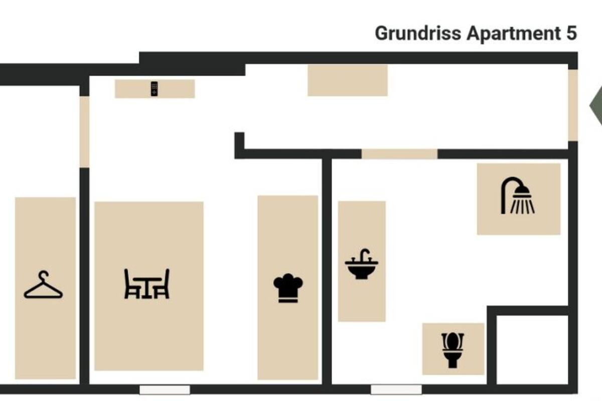 Grundriss der Wohnung 5 mit einem Zimmer (180 x 200 cm), einer Küche, einem Badezimmer und einem Waschbereich.