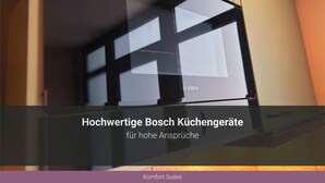 A modern interior with a large window and a door with a handle. - Apartments Casa da Enzo (Goslar)