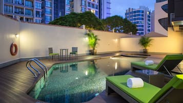 Outdoor pool, open 7 AM to 10:00 PM, pool loungers