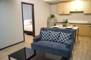 Apartment, 2 Bedrooms | Living area | 32-inch LCD TV with cable channels, TV