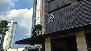 A G5 Hotel building with a modern design, featuring a prominent vertical structure and a large entrance canopy. - G5 Hotel & Serviced Apartment (Johor Bahru)