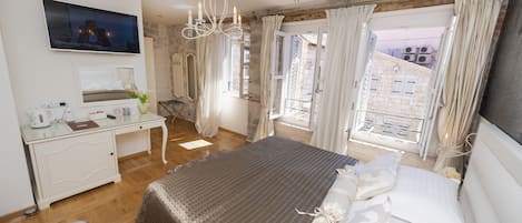 Deluxe Room, 1 King Bed | Premium bedding, minibar, in-room safe, individually decorated