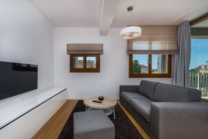 Premium Apartment, Garden View | Living area | Flat-screen TV, foosball, stereo