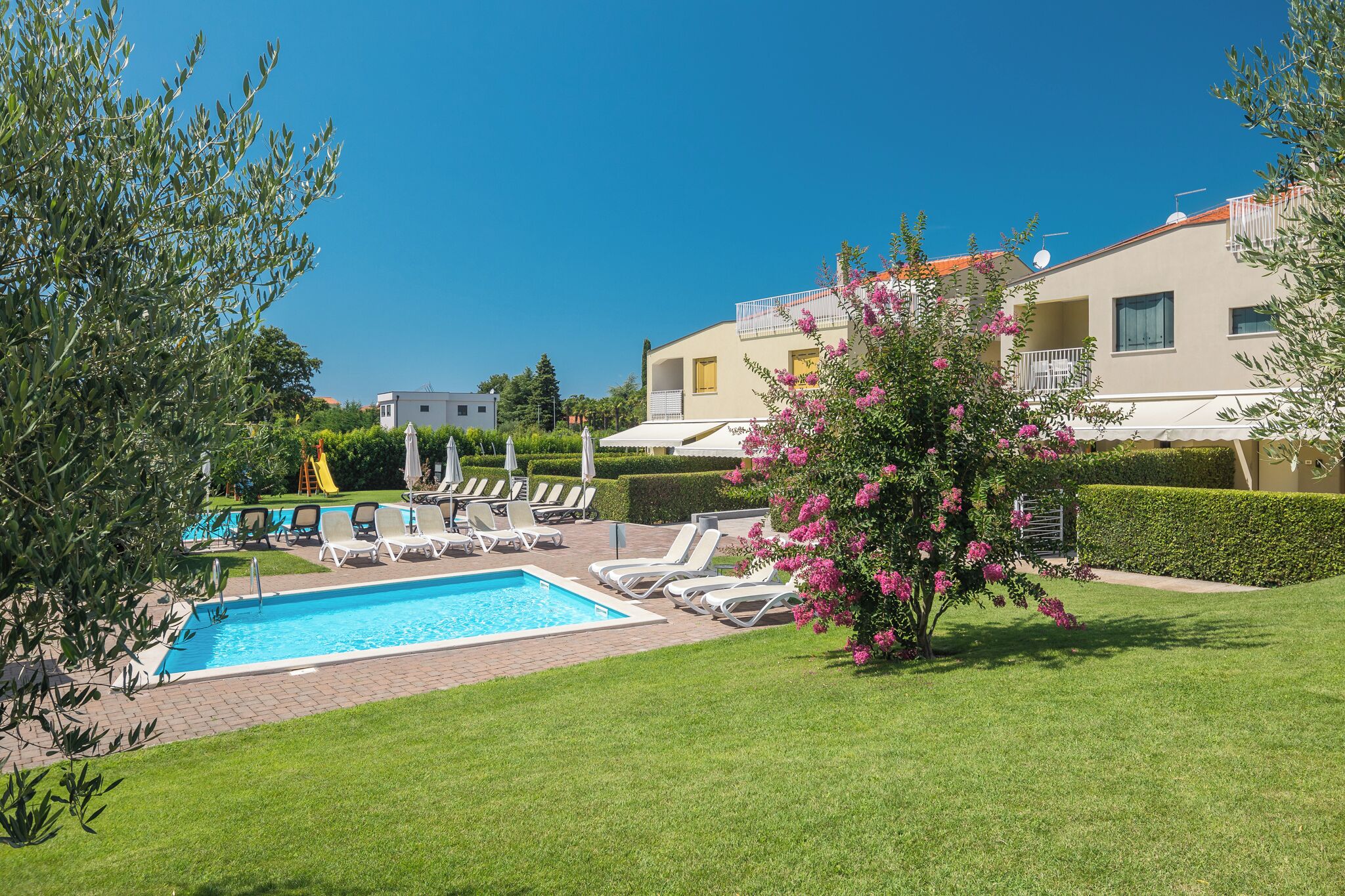 2 outdoor pools, pool umbrellas, pool loungers