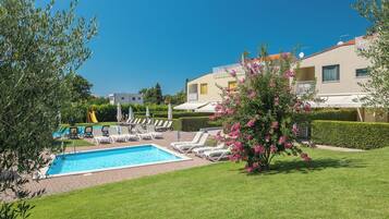 2 outdoor pools, pool umbrellas, pool loungers