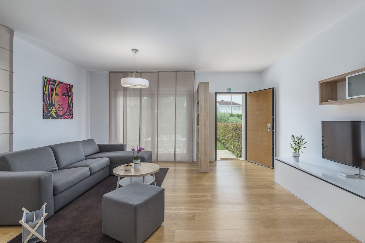 Premium Apartment, Garden View (Patio) | Living area | Flat-screen TV, table football, stereo