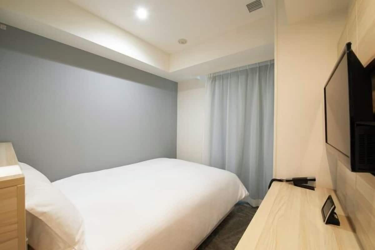Desk, blackout curtains, iron/ironing board (on request), free WiFi