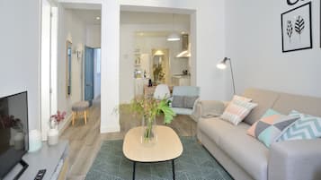 Apartment, 1 Bedroom, Balcony | Living room | Flat-screen TV