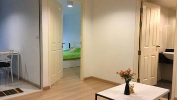 Business Condo, 1 Queen Bed with Sofa bed, Refrigerator & Microwave, Pool View | Living room | 40-inch LCD TV with digital channels, TV