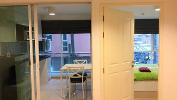 Business Condo, 1 Queen Bed with Sofa bed, Refrigerator & Microwave, Pool View | Living room | 40-inch LCD TV with digital channels, TV