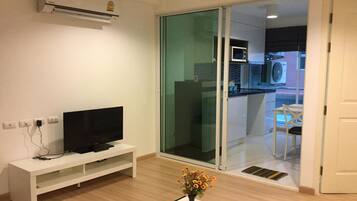 Business Condo, 1 Queen Bed with Sofa bed, Refrigerator & Microwave, Pool View | Living room | 40-inch LCD TV with digital channels, TV